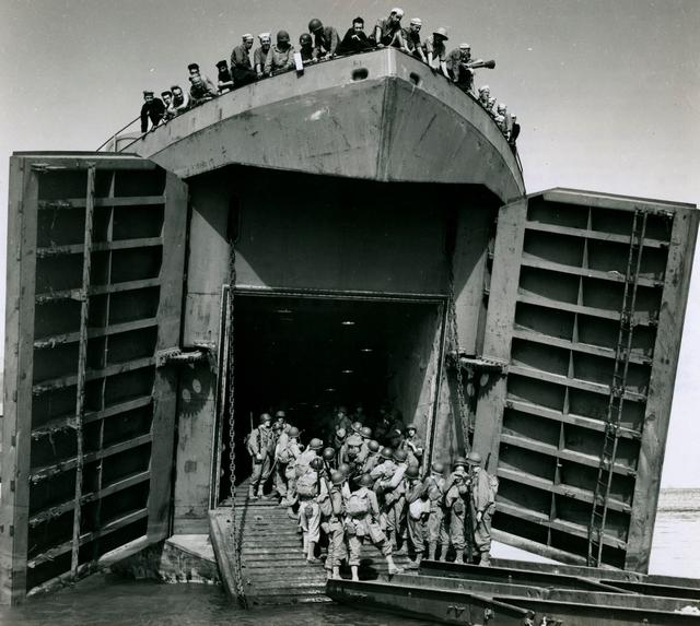 1942_troops_boarding_a_us_navy_tank_landing_ship_off_the_coast_of_north_africa.jpg