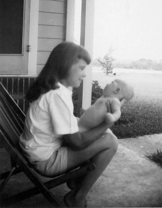 1953_janis_joplin_holding_her_baby_brother_texas.jpg