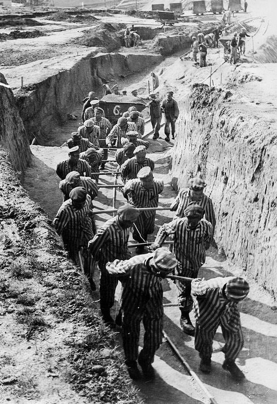 1942_prisoners_hauling_earth_for_the_construction_of_the_russian_camp_at_the_mauthausen_concentration_camp.jpg