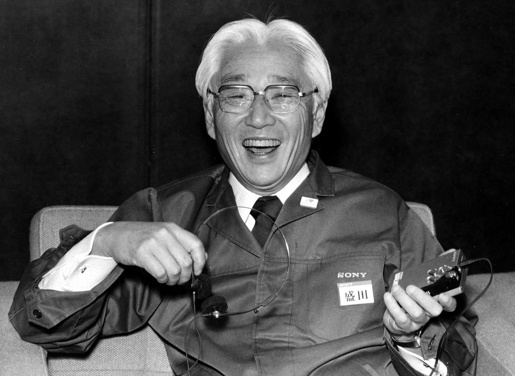 1982_sony_corp_chairman_akio_morita_laughs_during_a_meeting_where_he_displays_a_walkman_in_tokyo_japan_by_1989_more_than_100_million_walkmans_would_be_sold.jpg