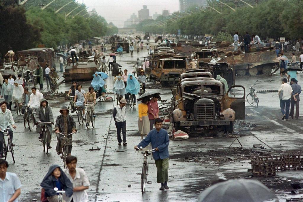 1989_people_walk_through_the_aftermath_of_the_crackdown_of_the_tiananmen_square_protests.jpg