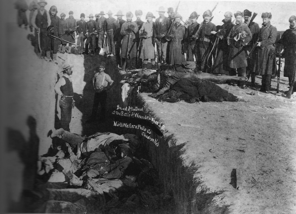 1890_mass_grave_for_the_300_lakota_people_massacred_by_the_u_s_army_soldiers_on_december_29_1890_near_wounded_knee_creek.png