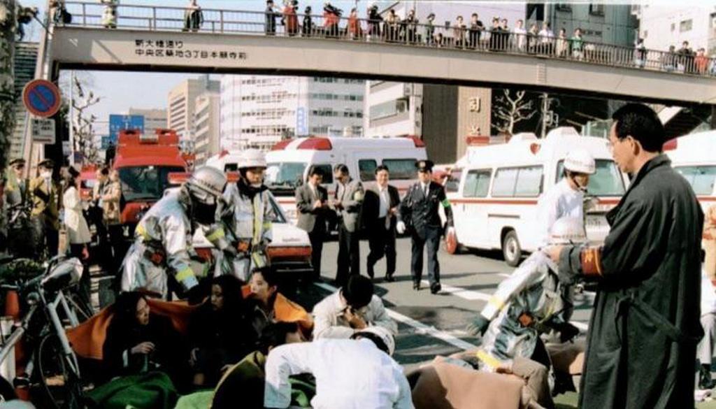 1995_patients_receiving_treatment_in_front_of_tsukiji_station_in_tokyo_after_a_sarin_gas_attack_perpetrated_by_the_aum_shinrikyo_cult.jpg