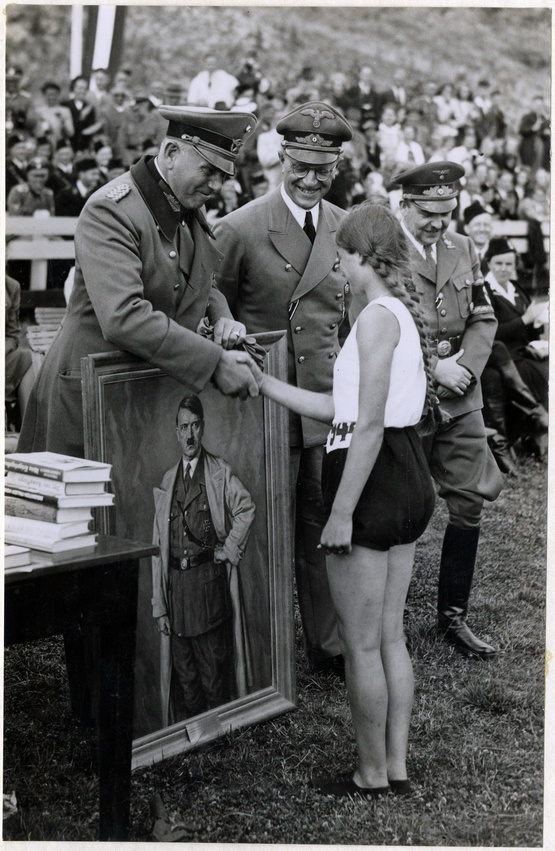 1941_a_dutch_athlete_receives_a_portrait_of_adolf_hitler_as_a_sports_prize_presented_by_general_otto_schumann_commander_of_the_ordnungspolizei_the_hague_the_netherlands.jpg