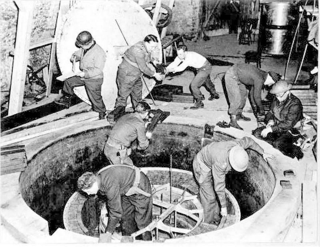 1945_german_experimental_nuclear_pile_at_the_haigerloch_research_reactor_it_was_being_dismantled_by_u_s_british_and_other_soldiers.jpg