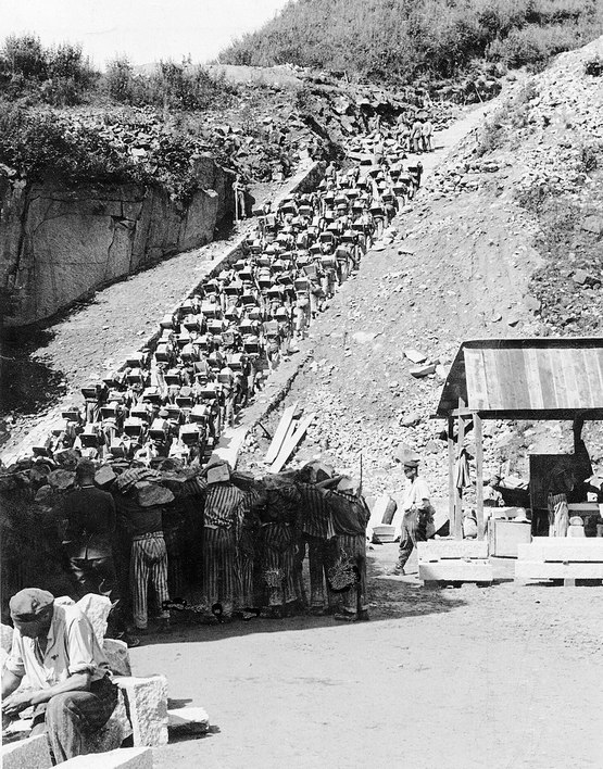 1942_stairs_of_death_prisoners_forced_to_carry_a_granite_block_that_weight_as_much_as_50_kilograms_up_186_steps_to_the_top_of_the_quarry_in_the_mauthausen_concentration_camp.jpg