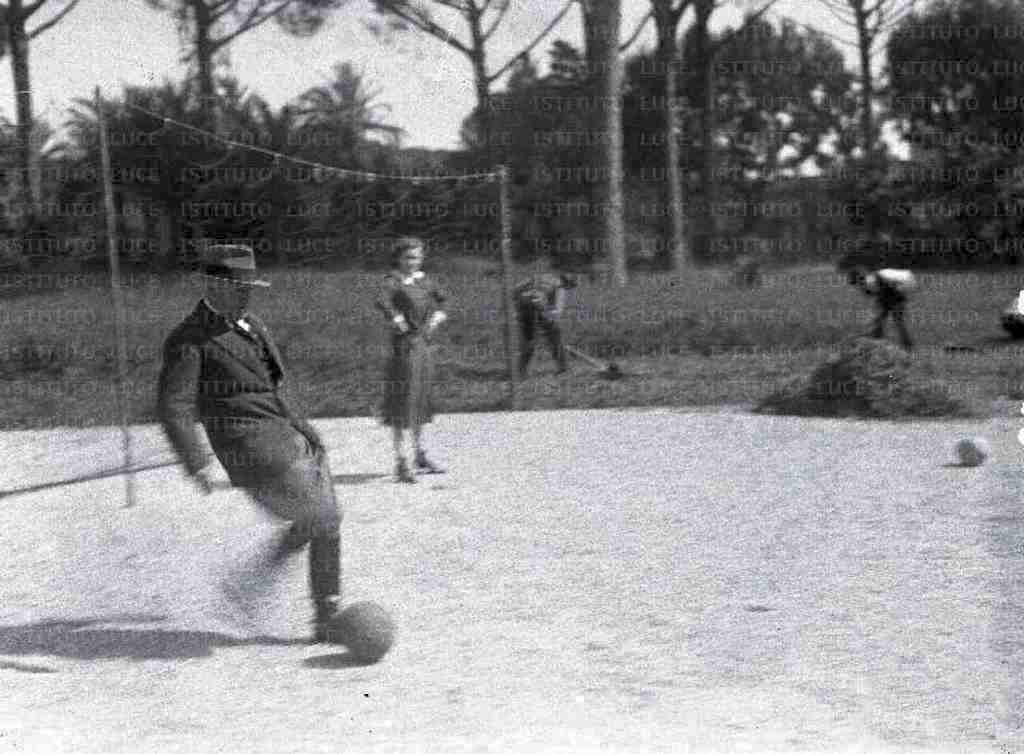 1930_mussolini_playing_football_in_the_garden_of_villa_torlonia_rome_italy.jpg
