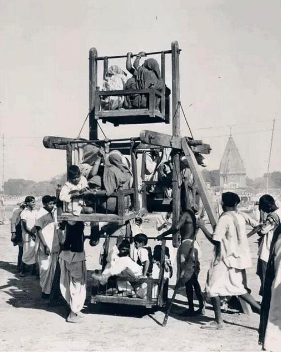 1962_people_riding_on_a_makeshift_ferris_wheel_in_varanasi_india.jpg