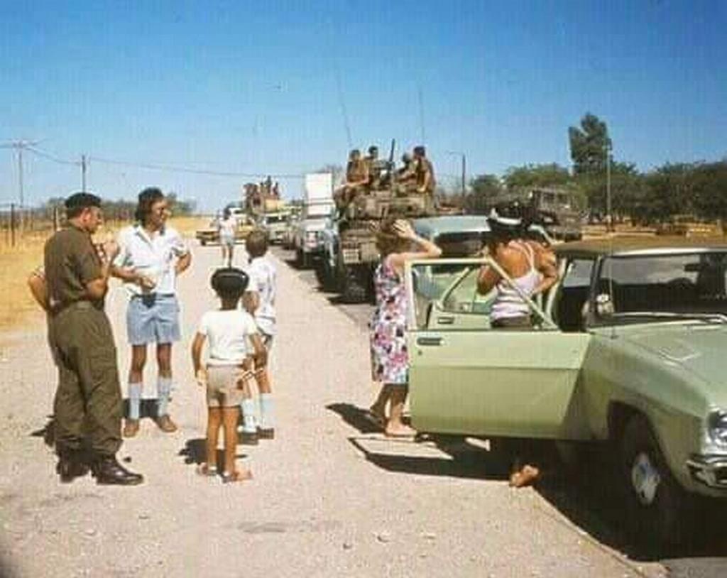 1975_white_portuguese_civilians_with_armoured_vehicles_of_the_south_african_army_during_exodus_of_white_europeans_from_angola.jpg