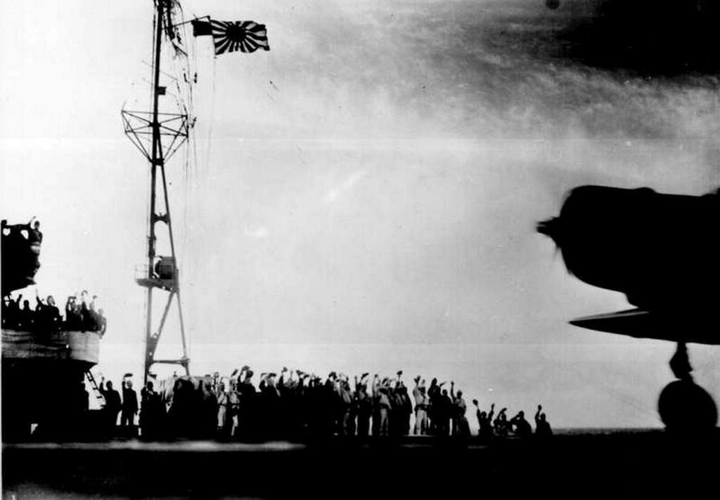 1941_dec_7_on_japanese_aircraft_carrier_servicemen_waving_farewell_to_one_of_the_planes_about_to_attack_on_u_s_naval_base_at_pearl_harbor.jpg