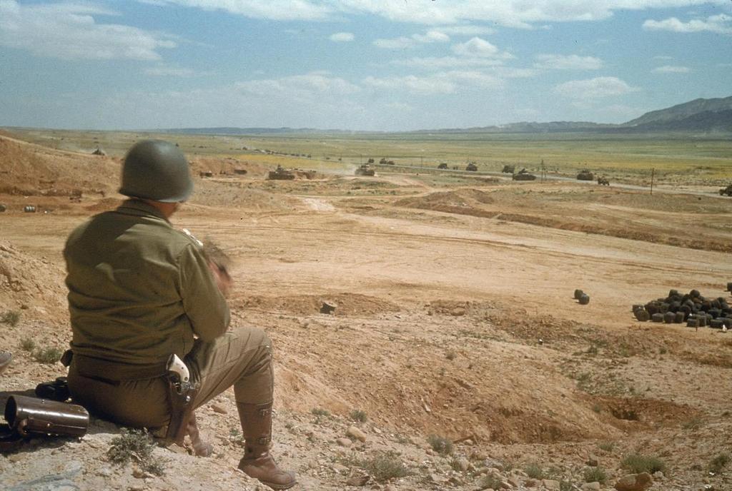 1943_general_george_s_patton_watches_his_troops_advance_across_the_el_guettar_valley_tunisia.jpg