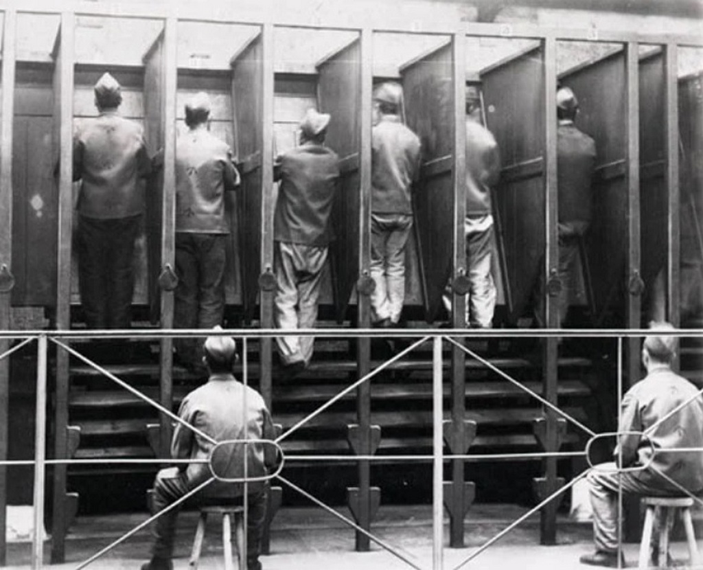 1895_convicts_in_an_english_prison_taking_their_turn_on_the_treadwheel_a_rotating_cylinder_used_to_generate_power.jpg