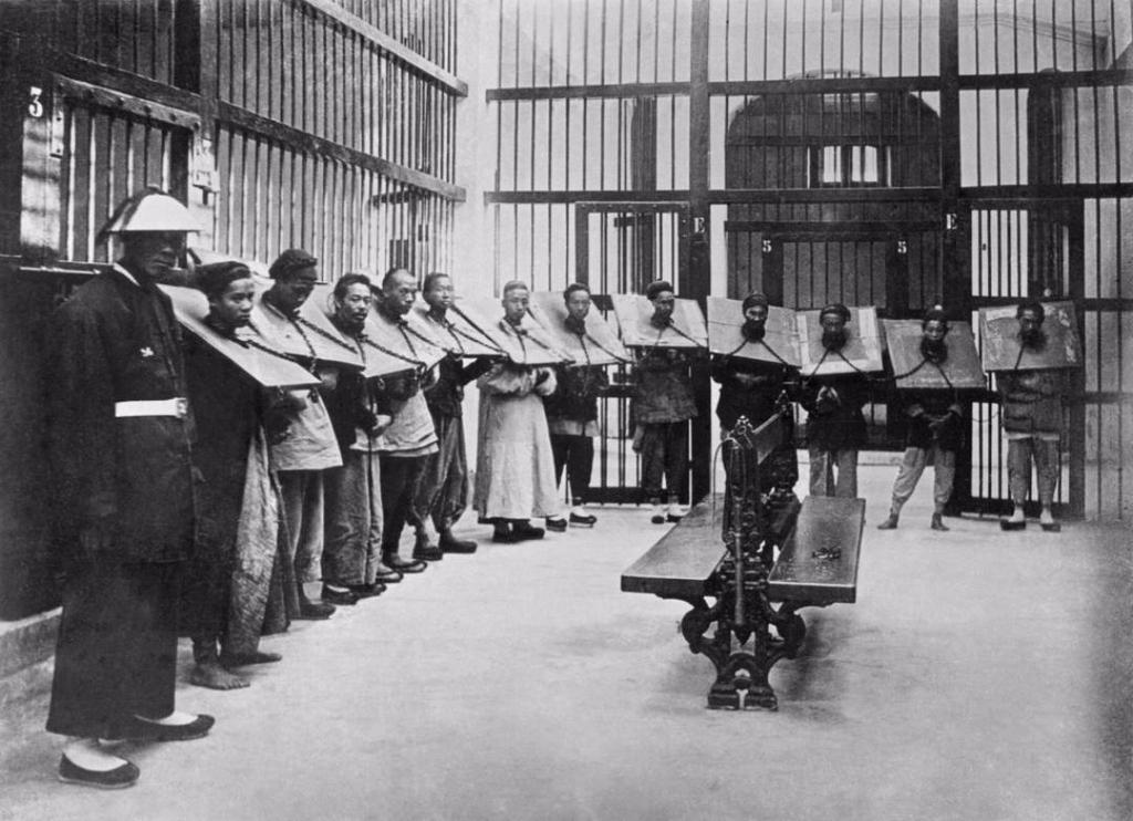 1895_offenders_punished_with_a_period_of_imprisonment_in_a_wooden_cangue_china.jpg