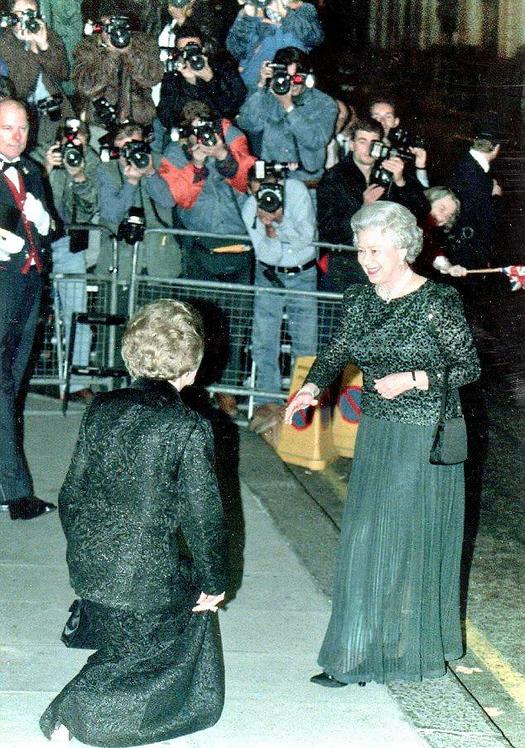 1995_margaret_thatcher_at_her_70th_birthday_dinner_nearly_touches_the_ground_as_she_curtsies_to_queen_elizabeth_ii.jpg