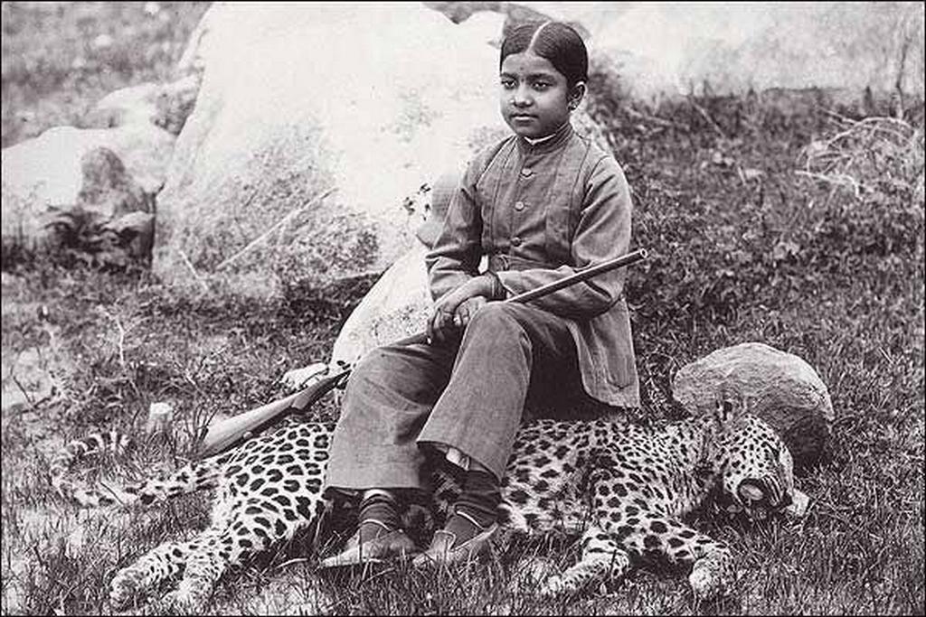 1920_young_daughter_of_an_indian_maharaja_sitting_on_a_leopard_that_she_hunted_down.jpg