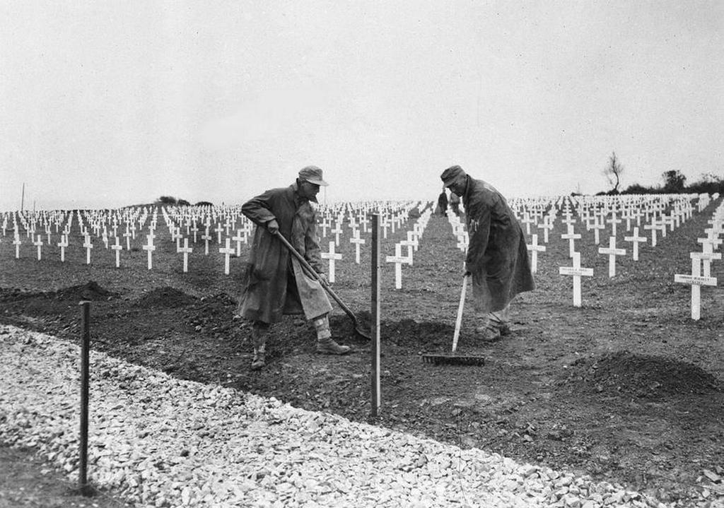 1945_one_year_after_the_d-day_landings_in_normandy_german_prisoners_landscape_the_first_u_s_cemetery_at_saint-laurent-sur-mer_france_near_omaha_beach.jpg