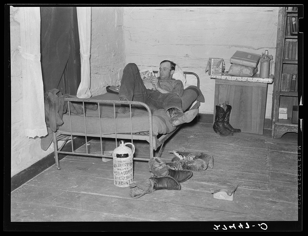 1939_cowboy_relaxing_in_the_bunkhouse_montana.jpg
