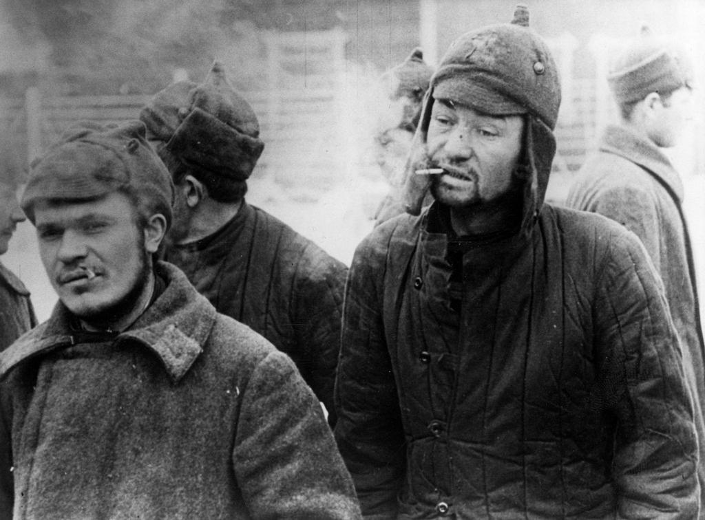 1940_soviet_pows_in_a_finnish_prison_camp_pass_time_with_a_cigarette.jpg