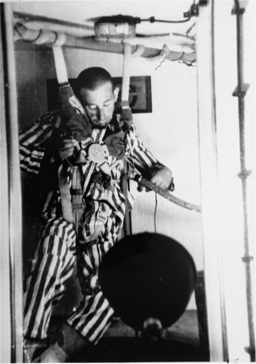 1942_a_dachau_prisoner_loses_consciousness_in_a_low-pressure_chamber_during_a_depressurization_experiment_being_conducted_by_ss_doctor_sigmund_rascher.png