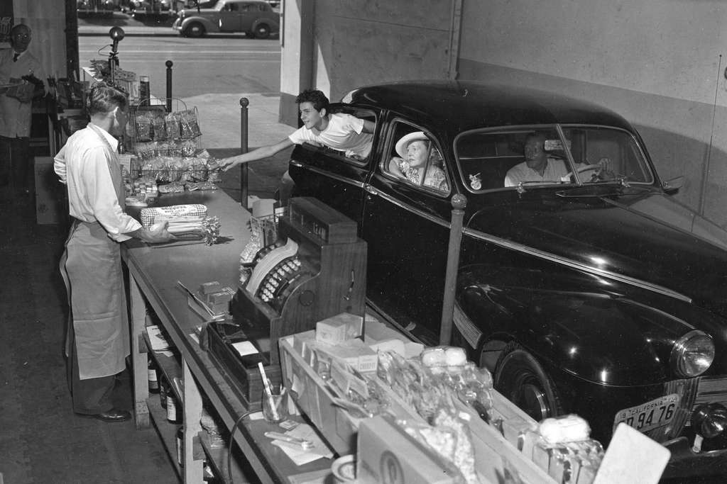 1949_customers_buying_bread_and_snacks_at_a_drive-through_market_and_liquor_store_in_los_angeles.jpg