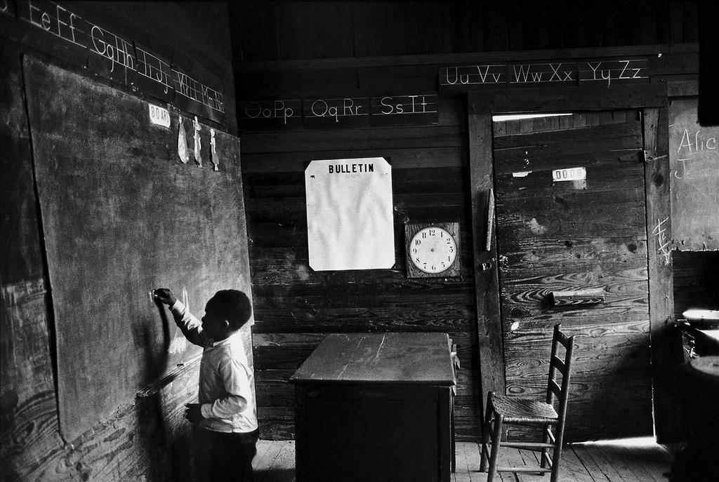 1965_student_draws_on_a_chalkboard_in_a_one-room_schoolhouse_in_selma_alabama.jpg