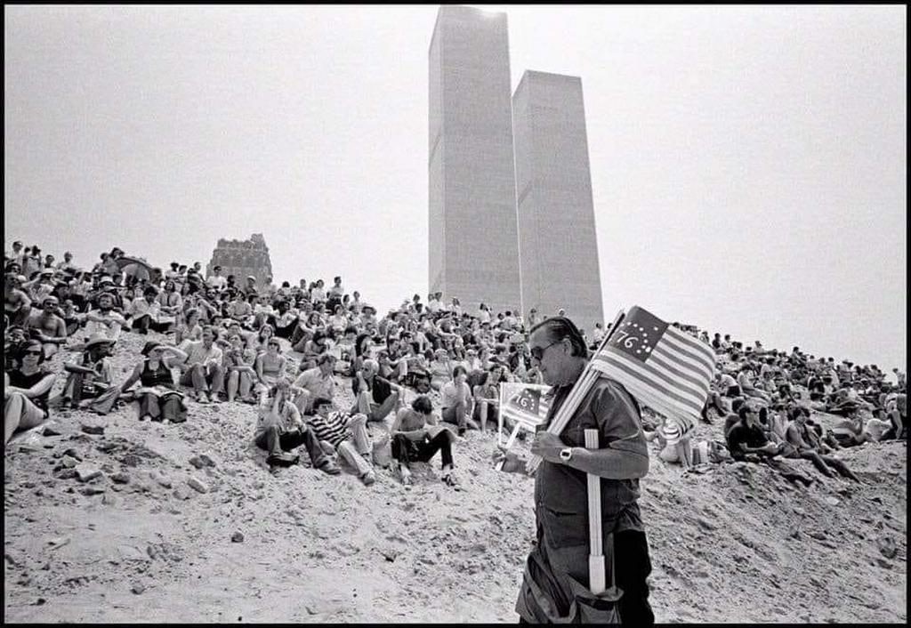 1976_julius_4_crowds_gather_to_watch_op_sail_with_twin_towers_in_background.jpg
