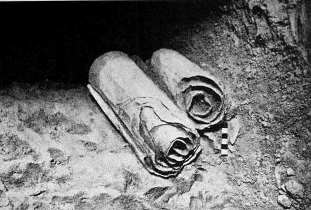 1947_two_of_the_dead_sea_scrolls_in_the_cave_where_they_were_found.jpg