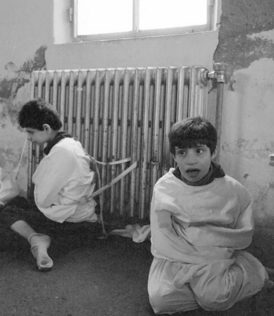 1982_two_autistic_kids_tied_to_the_radiator_of_an_asylum_spain.jpg
