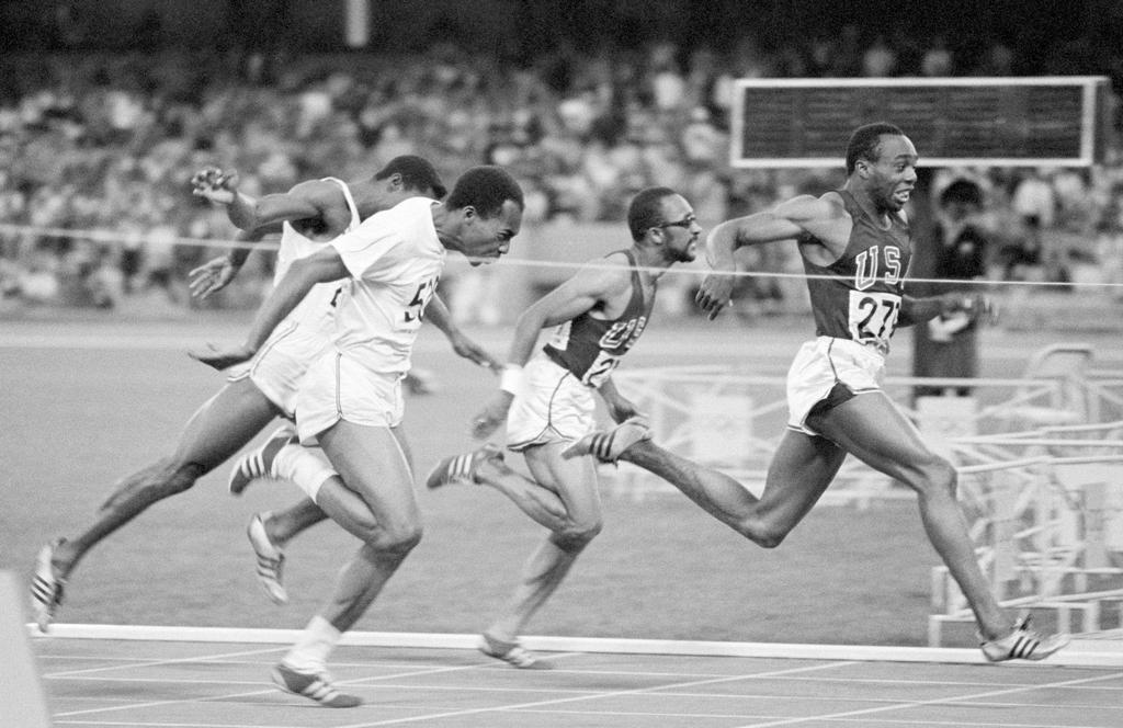 1968_jim_hines_of_the_united_states_crosses_the_finish_line_in_first_place_gold_medal_position_to_win_the_men_s_100_m_event_first_man_under_10_sec.jpg