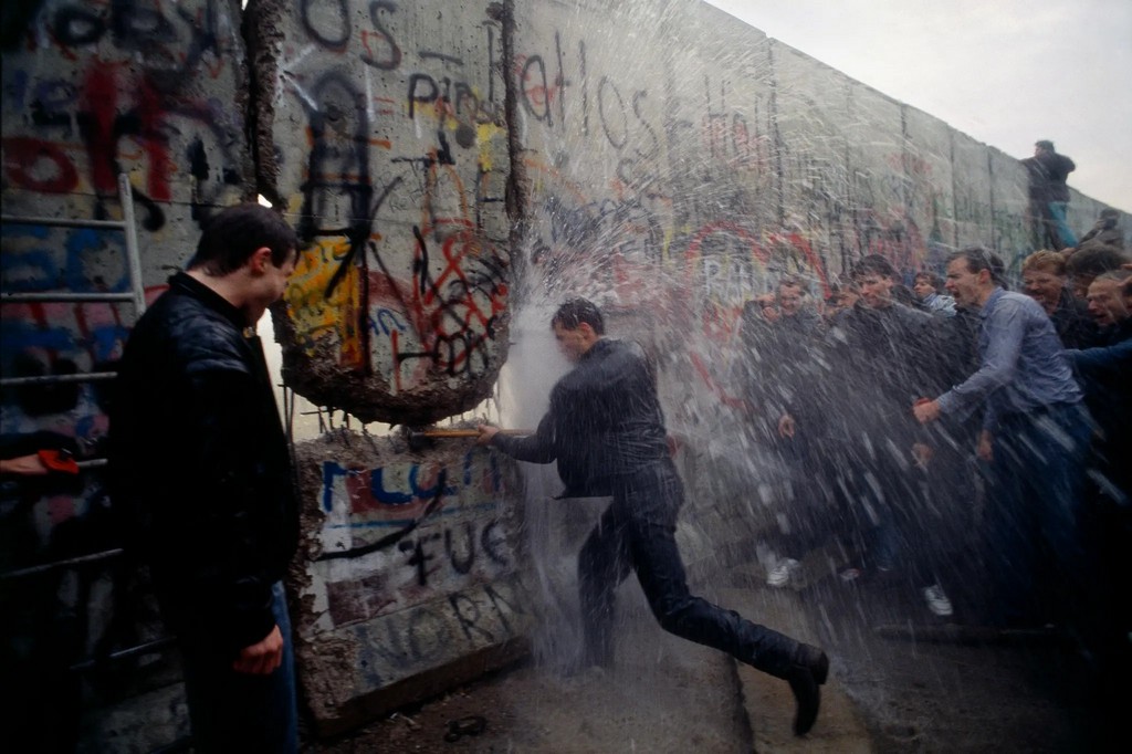 1989_east_german_police_spraying_water_on_west_germans_as_they_broke_through_the_berlin_wall.jpg