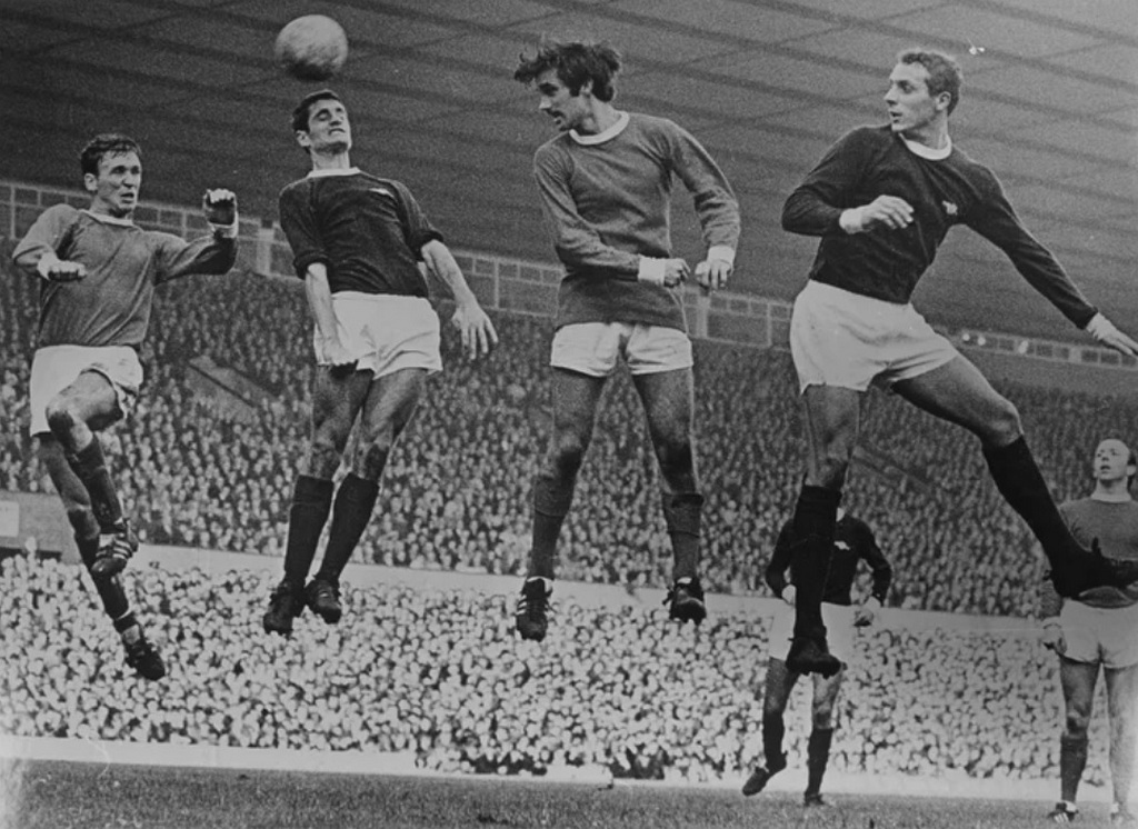 1967_pat_crerand_frank_mclinktock_george_best_and_john_radford_during_a_arsenal_v_manchester_united_match_at_old_trafford.jpg