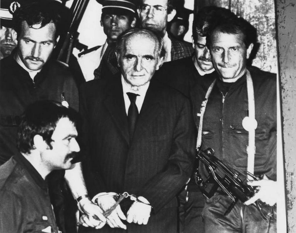 1987_klaus_barbie_walks_out_of_french_court_after_being_sentenced_to_life_4th_july_1987.jpg