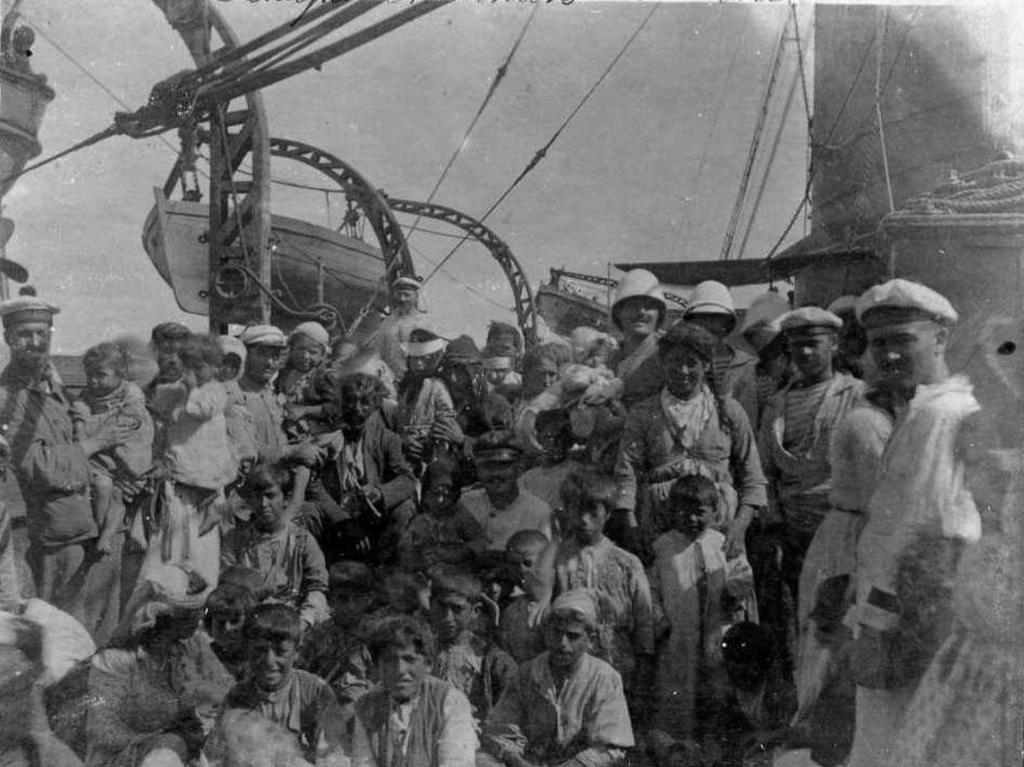 1915_french_sailors_pose_with_armenian_women_and_children_they_rescued_from_genocide_at_musa_dagh_cr.jpg
