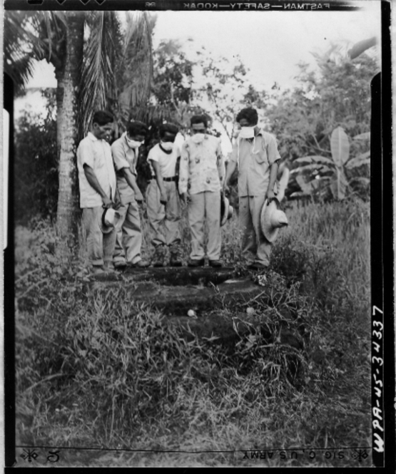 1945_filipino_men_point_a_well_where_women_and_children_were_thrown_then_crushed_with_rocks_during_a_massacre_of_japanese_occupation_forces_who_slaughtered_nearly_25_000_civilians_in_the_batangas.png