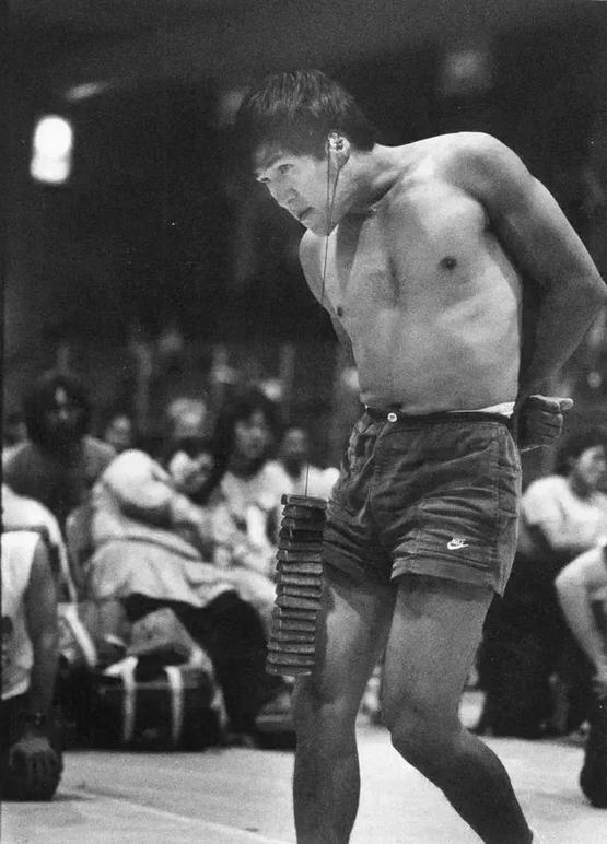 1984_joshua_okpik_competing_in_the_ear_weight_contest_in_world_eskimo_indian_olympics_fairbanks_alaska.jpg