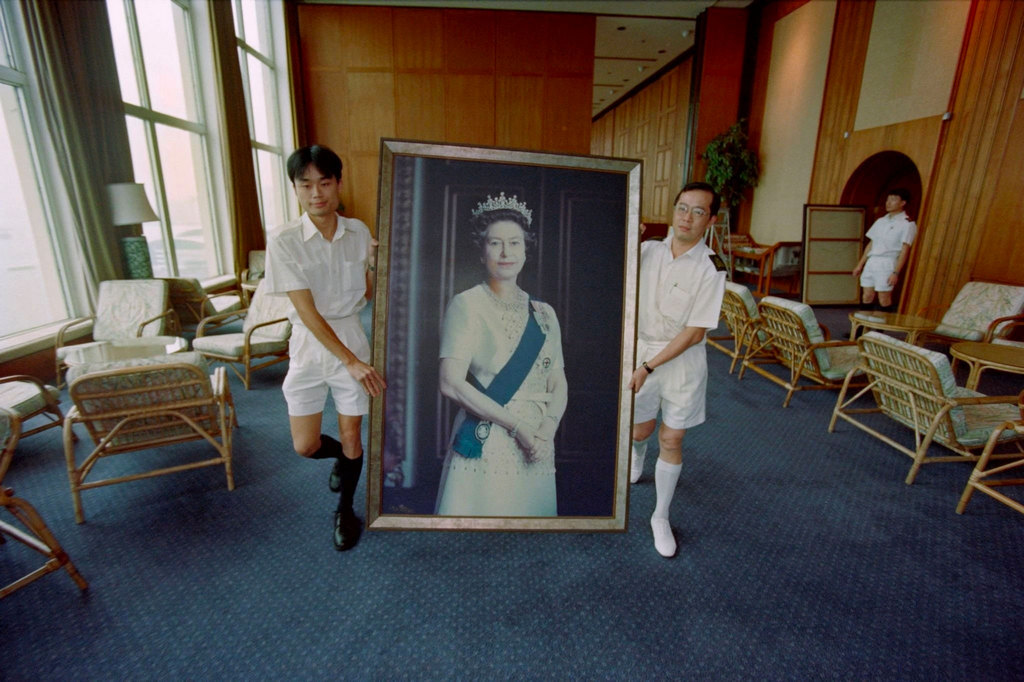 1997_a_portrait_of_queen_elizabeth_ii_is_removed_from_the_british_forces_headquarters_in_hong_kong_in_preparation_for_the_handover_of_the_territory_back_to_china.jpg