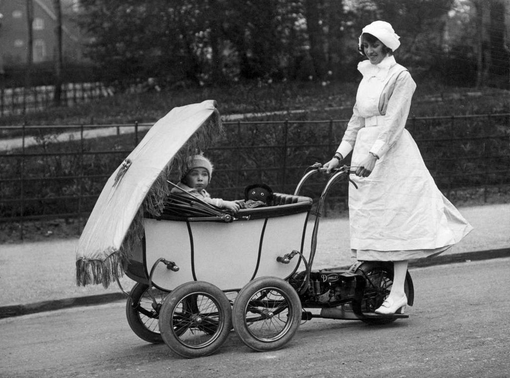 1922_an_english_nanny_driving_a_motorized_pram.jpg