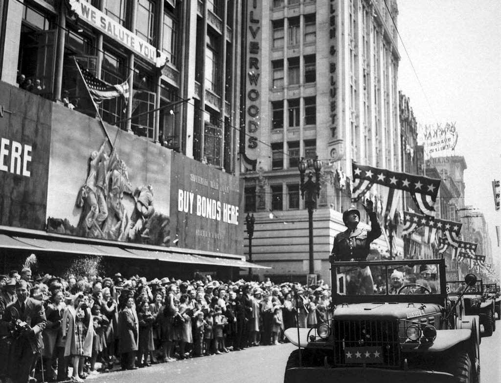 1945_06_09_u_s_general_george_s_patton_acknowledges_the_cheers_of_thousands_during_a_parade_through_downtown_los_angeles_california.jpg