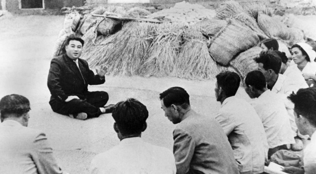 1945_10_01_communist_leader_kim_il_sung_chats_with_a_farmer_from_qingshanli_kangso_county_south_pyongyang_in_north_korea.jpg