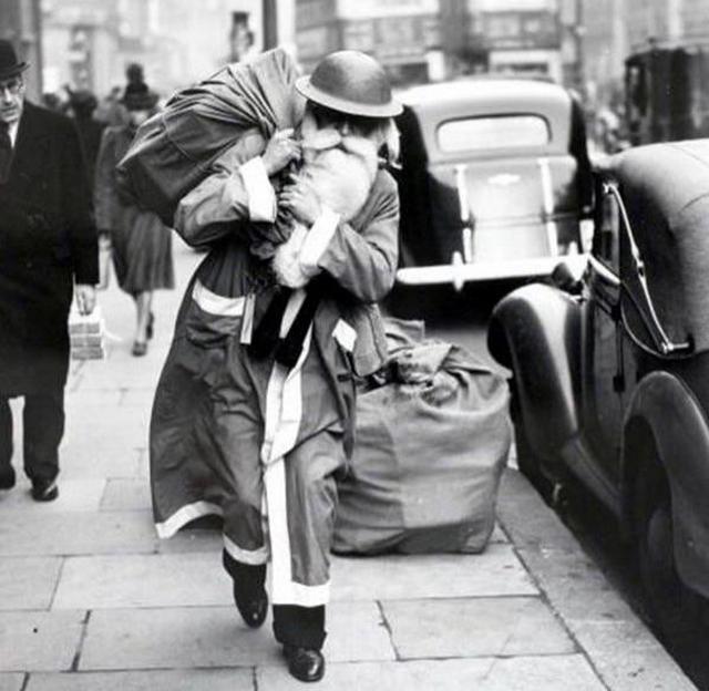 1940_santa_claus_delivers_presents_wearing_a_helmet_during_the_london_blitz.jpg