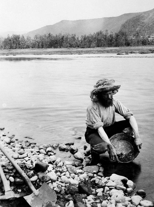 1896_a_prospector_pans_for_gold_in_the_yukon_river_during_the_klondike_gold_rush_of_1896_dawson_city_yukon_territory_canada.jpg