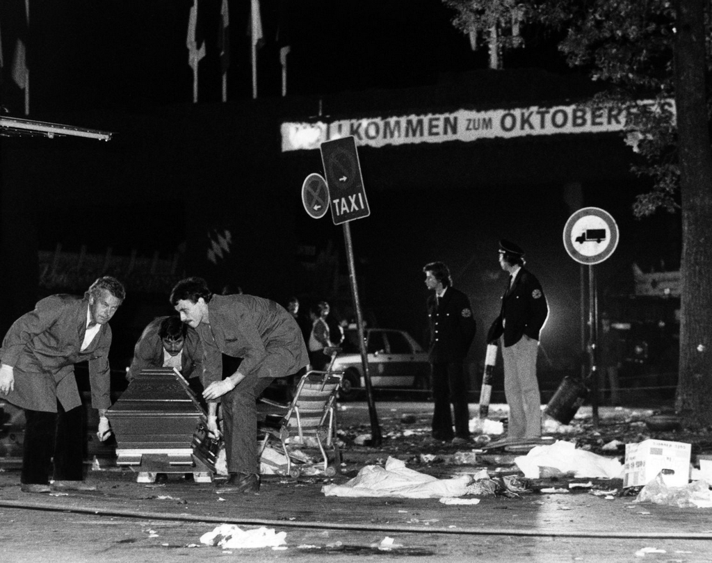 1980_west_german_police_officials_clean_up_in_the_aftermath_of_a_terrorist_attack_in_munich_oktoberfest_killed_12.png