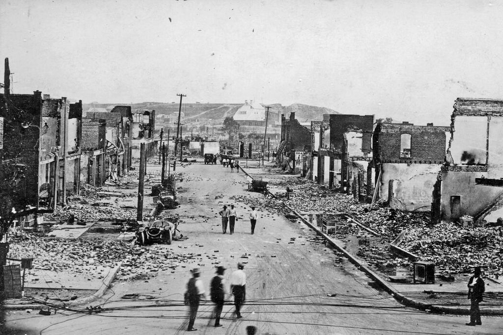 1921_greenwood_avenue_in_tulsa_destroyed_of_hours_it_was_also_in_a_sense_the_first_aerial_bombing_conducted_on_american_soil_firebombs_thrown_from_biplanes_over_300_peo.jpg