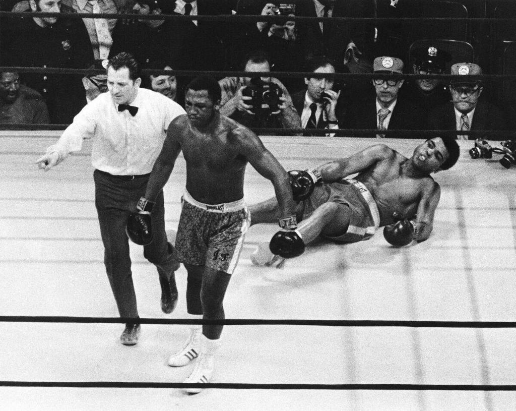 1971_joe_frazier_walking_back_to_his_corner_after_knocking_down_muhammad_ali_in_the_11th_round.jpg
