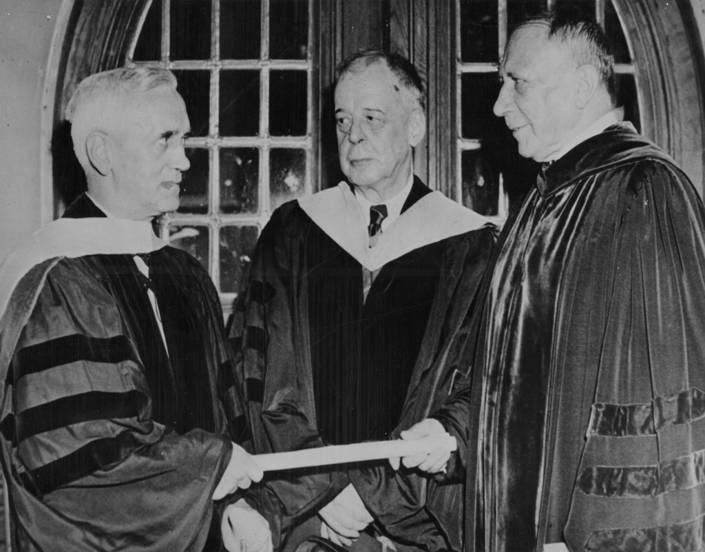 1945_sir_alexander_fleming_left_the_discoverer_of_penicillin_1928_receiving_an_honorary_doctorate_from_dr_thomas_s_gates_president_of_the_university_of_pennsylvania.jpg