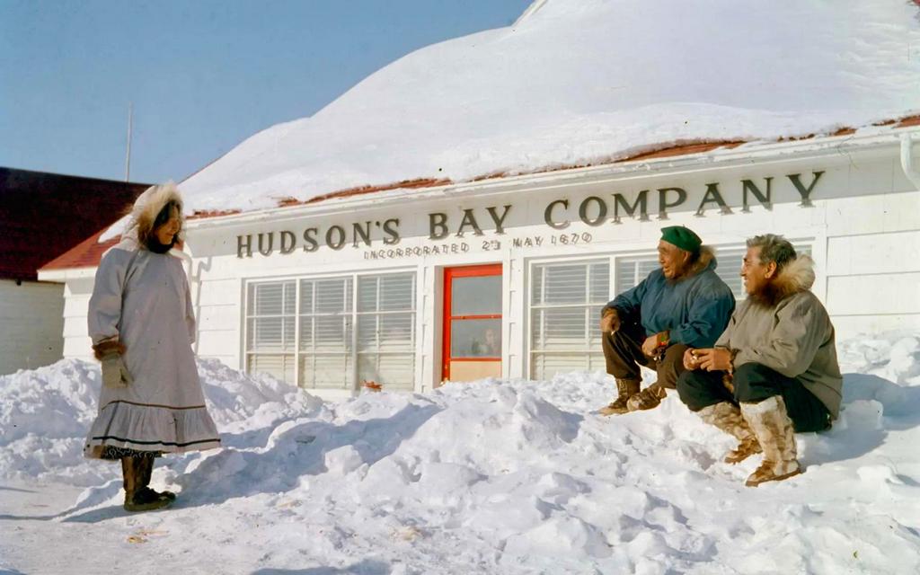 1956_inuit_villagers_chatting_outside_the_hudson_s_bay_company_trading_post_in_aklavik_northwest_territories_canada.jpg