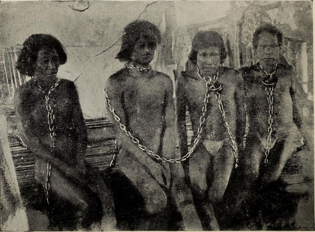 1913_chained_indigenous_workers_of_anglo-peruvian_amazon_rubber_co.jpg