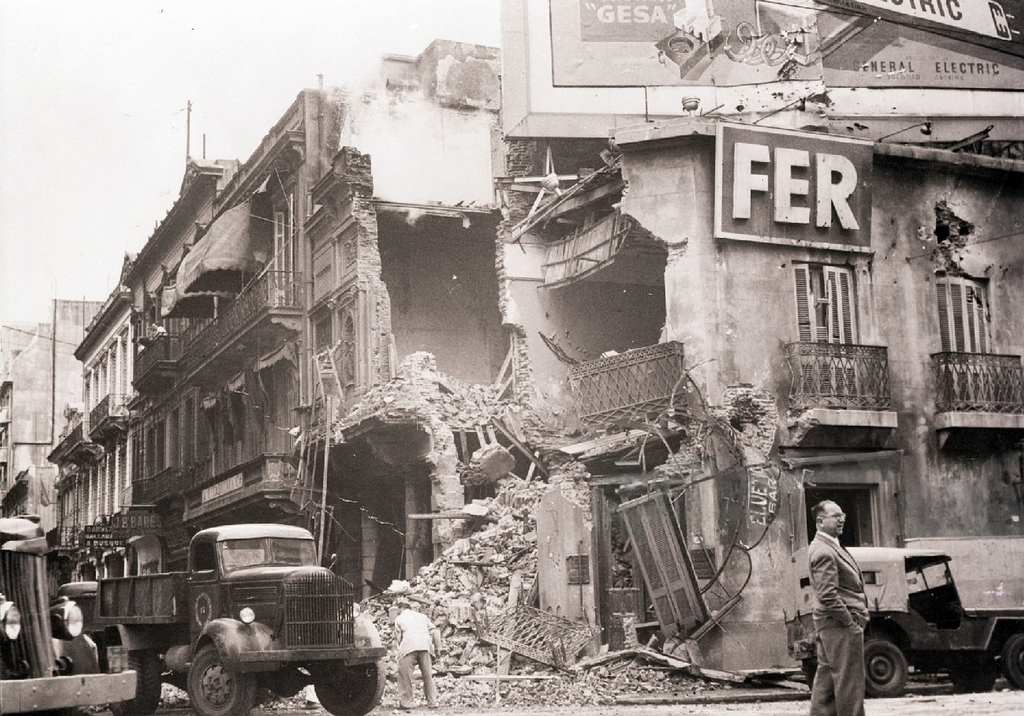 1955_building_banged_up_by_army_tanks_and_cannon_during_the_revolt_against_the_regime_of_president_juan_peron_buenos_aires_argentina_cr.jpg