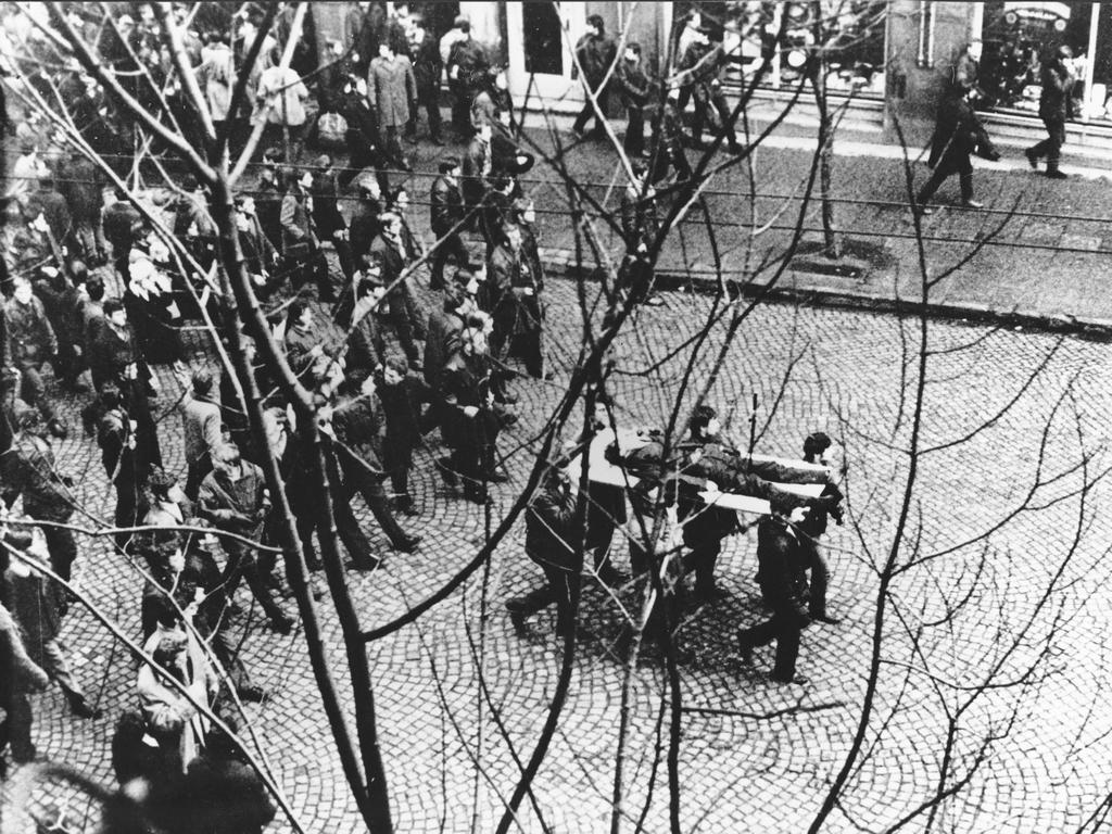 1970_polish_protesters_carry_on_a_door_wing_body_of_zbigniew_godlewski_18-year-old_port_worker_shot_by_ppa_during_a_demonstration_in_which_40_people_were_killed_gdynia.jpg