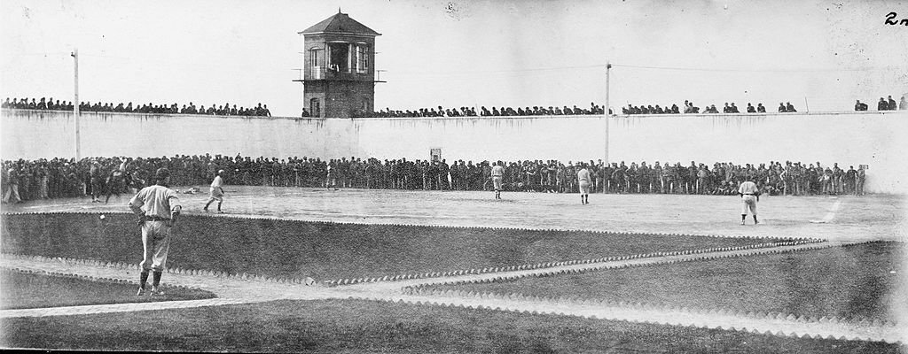 1920_in_an_unknown_prison_yard_a_baseball_game_is_in_progress.jpg